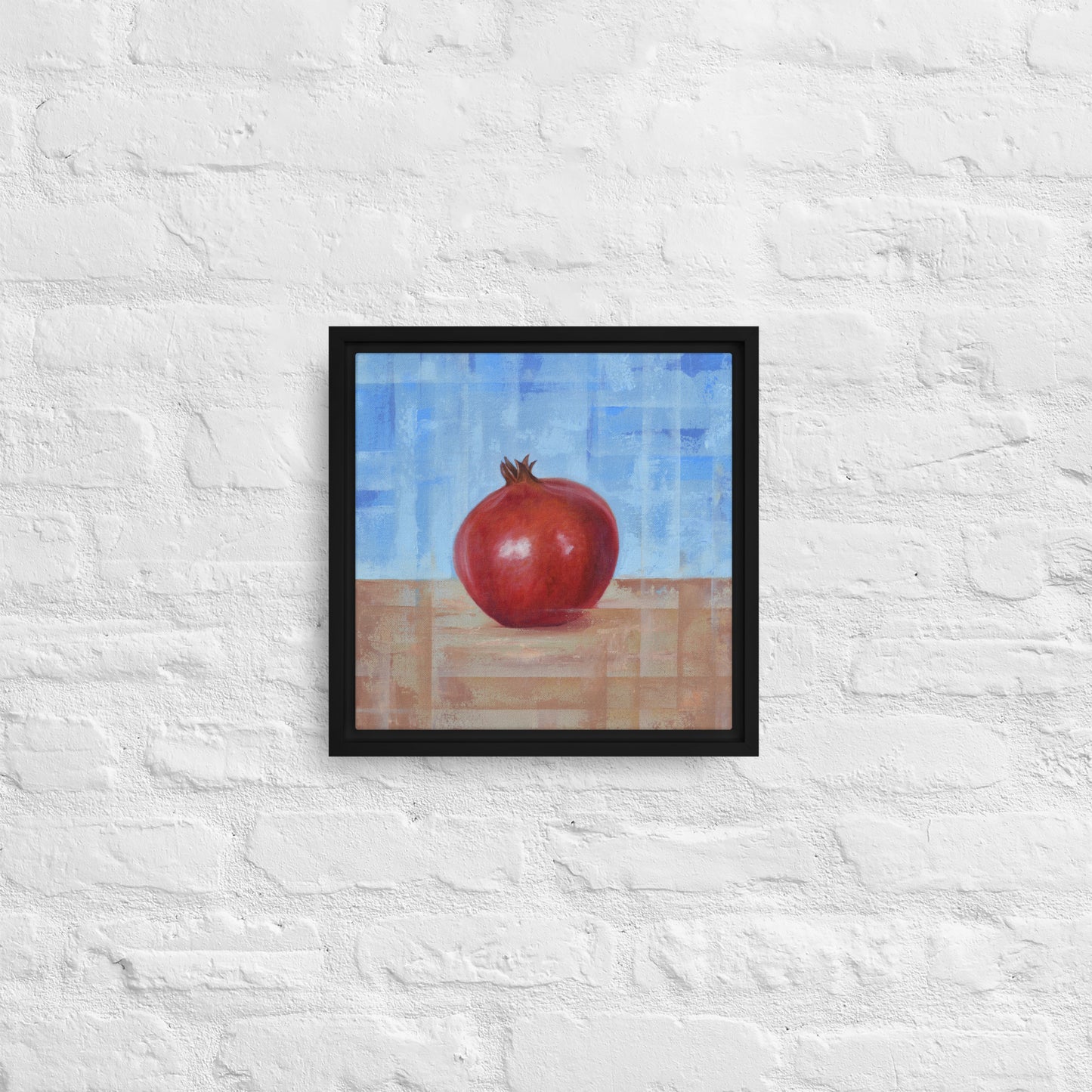 Fruit Painting by artist Shawn Dixon shown a framed canvas pomegranate print with a black frame